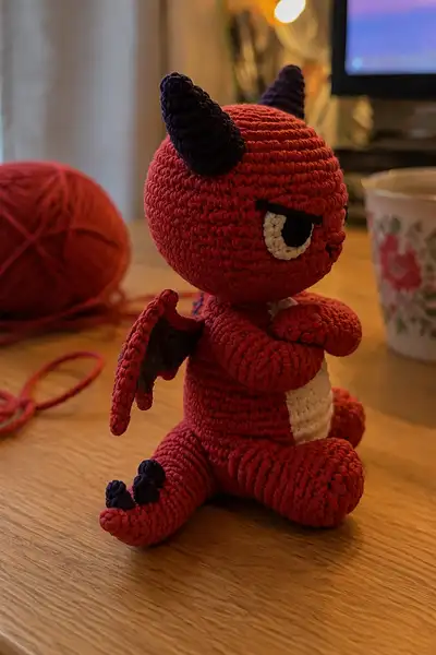 Small Furious Devil Dragon with Crossed Arms Amigurumi Pattern step 2 - assembly progress