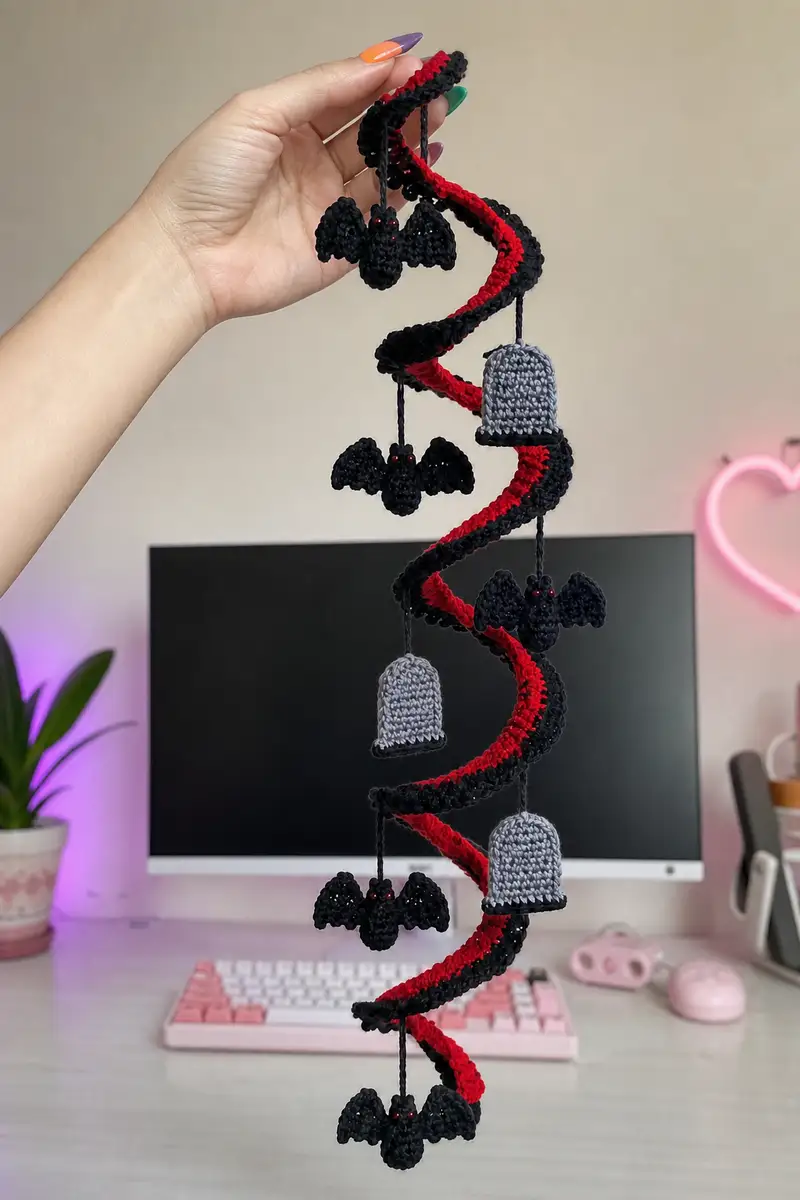 Free crochet pattern: Red and Black Spiral Halloween Garland with Bats and Tombstones Pattern - Intermediate level tutorial
