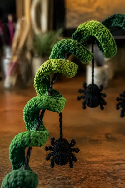 Green Spiral Halloween Garland with Dangling Spiders Pattern step 2 - assembly progress