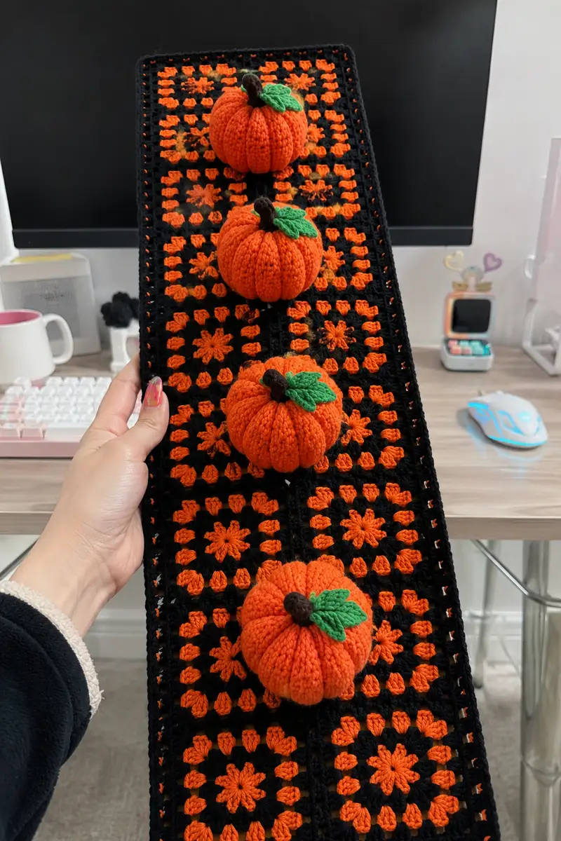 Black and Orange Granny Square Row Table Runner with Pumpkins Pattern crochet pattern - detailed view of completed project