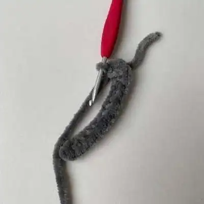 Plush Booties with Pompoms Pattern step 3 - details and accessories