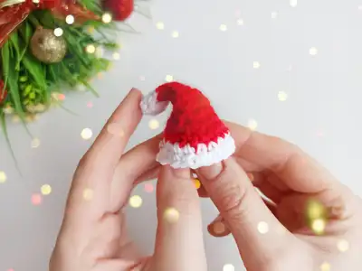 Mini Christmas Hat Amigurumi Pattern step 4 - final assembly and finishing