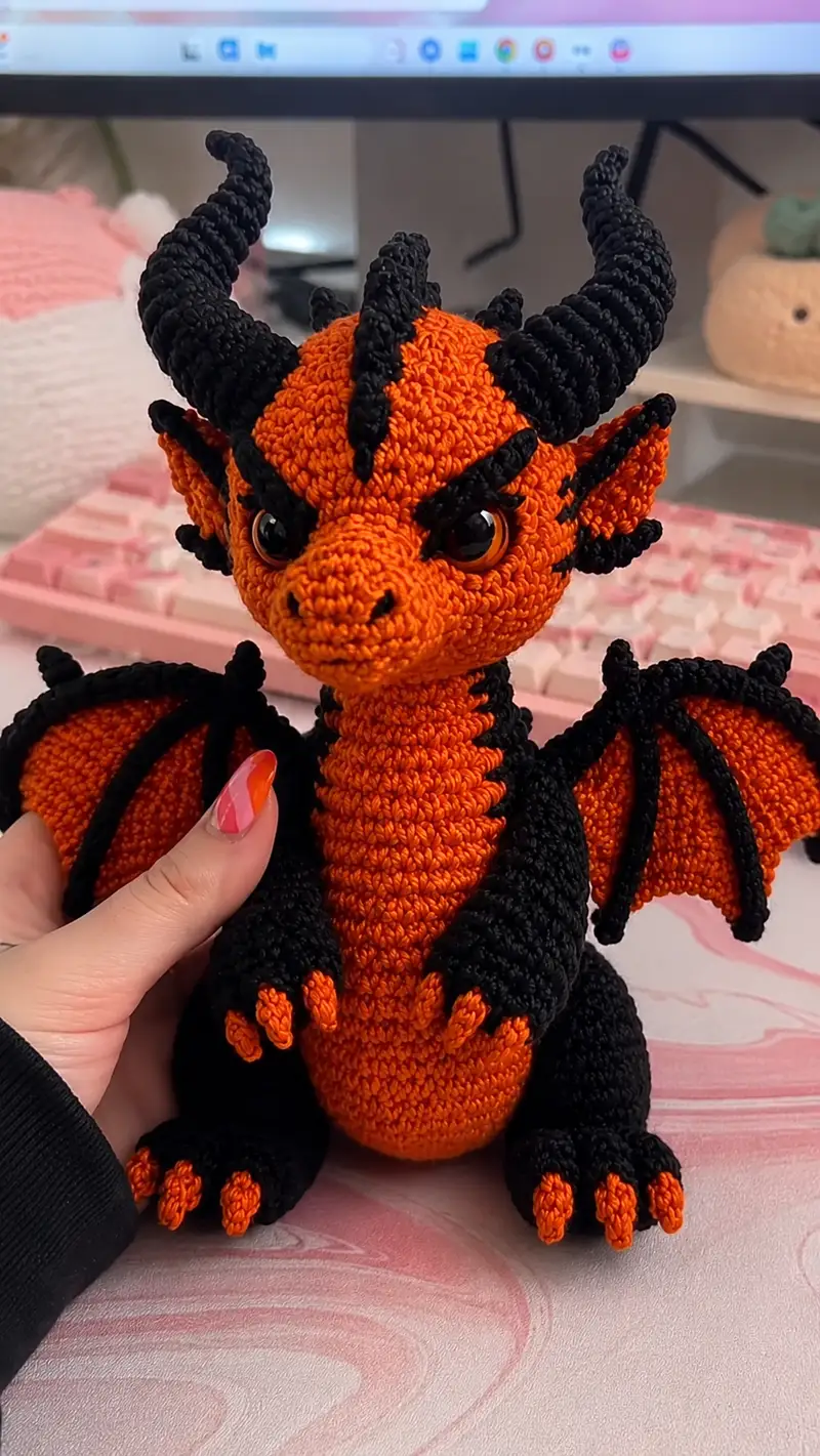 Orange & Black Little Dragon Amigurumi Pattern crochet pattern - detailed view of completed project