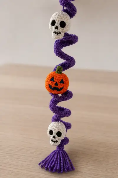 Purple Spiral Halloween Garland with Skulls and Pumpkins Pattern step 2 - assembly progress