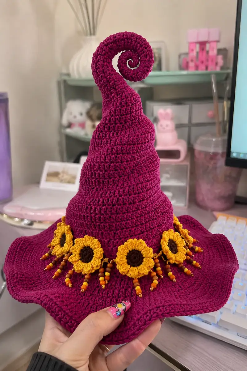 Big Magenta Spiral Witch Hat with Sunflower Band Pattern crochet pattern - detailed view of completed project