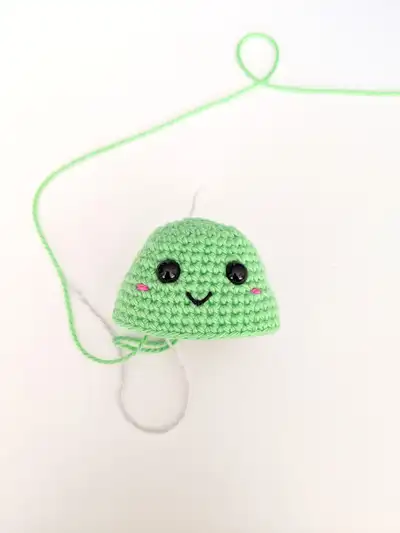 Colourful Mini Dino Amigurumi Pattern step 4 - final assembly and finishing