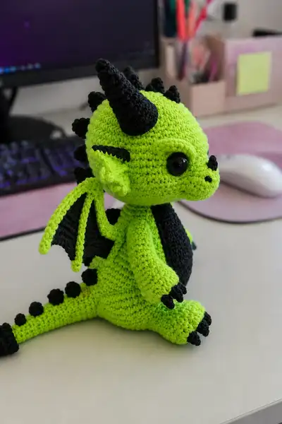 Toxic Green Demon Dragon with Black Horns and Spiked Tail Amigurumi Pattern step 2 - assembly progress