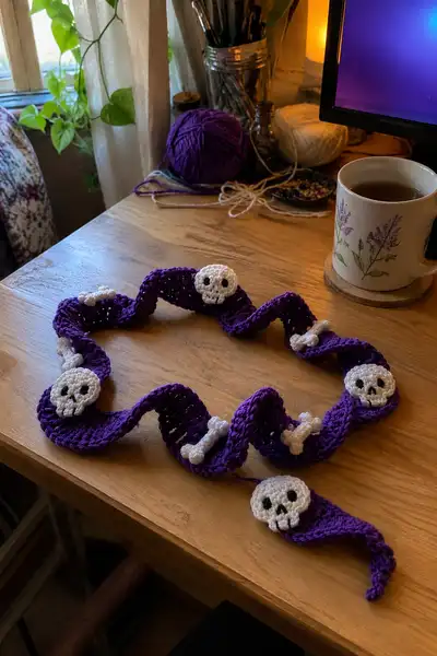 Purple Spiral Halloween Garland with Skulls and Bones Pattern step 1 - construction progress