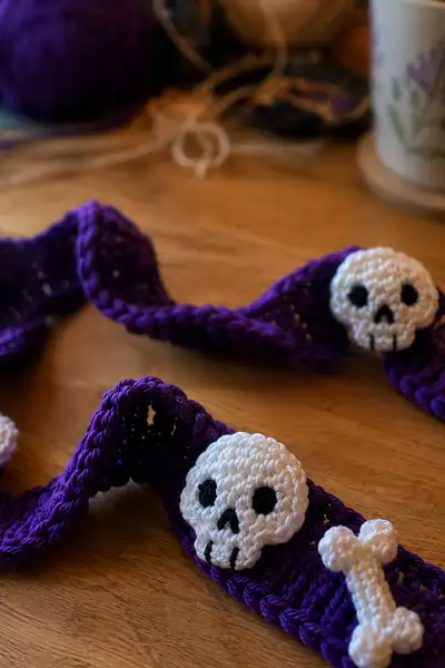 Purple Spiral Halloween Garland with Skulls and Bones Pattern step 2 - assembly progress